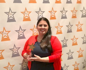 Southside Electric Cooperative Communications Specialist Lauren Irby accepts the 2017 Spotlight on Excellence Gold Award in Best Digital Storytelling for SEC’s “Day in the Life of a Lineman” reality show.